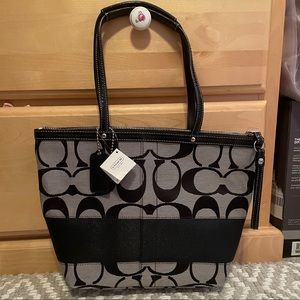 Coach “Signature Strap Tote” bag